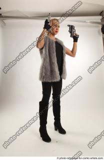 11 2018 01 NIKOL STANDING POSE WITH TWO GUNS
